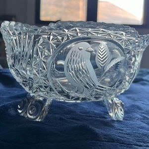 A 7.5" tall etched Hofbauer Byrdes crystal footed bowl with a scalloped rim.